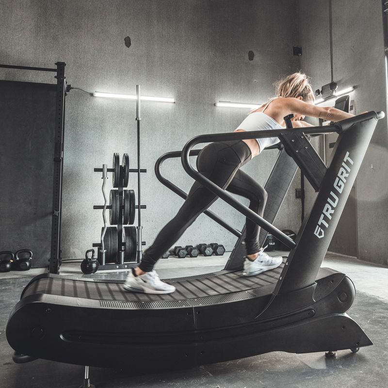 Tru Grit Grit Runner Curved Manual Treadmill - front three-quarter view showing curved running surface