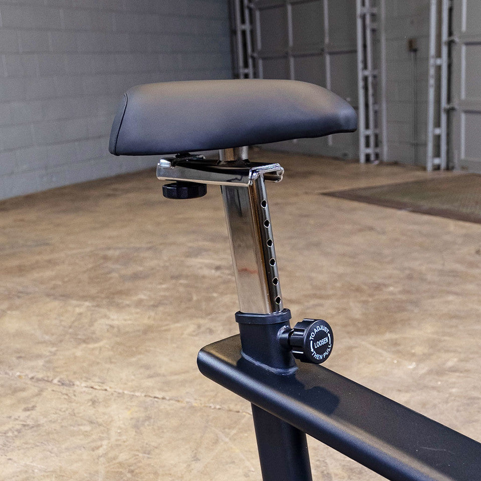 Body-Solid B4U Upright Bike - front view showing adjustable seat and pedals