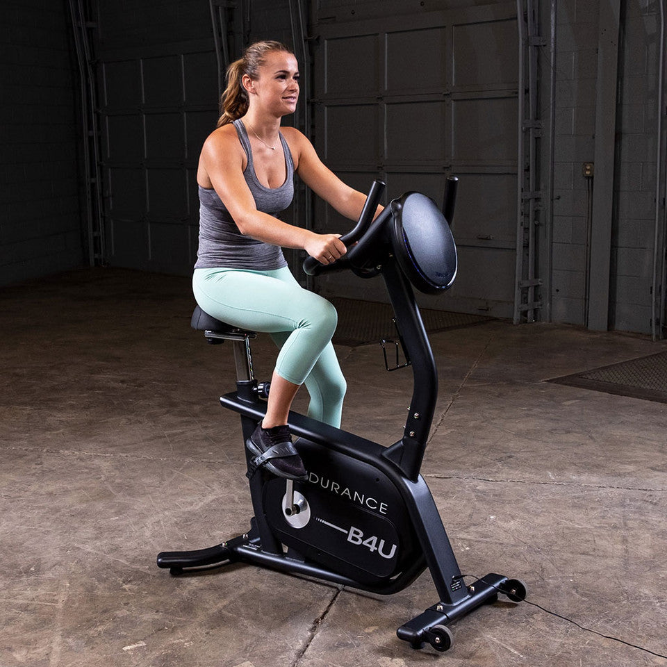 Body-Solid B4U Upright Bike - side view showing vertical riding position and console