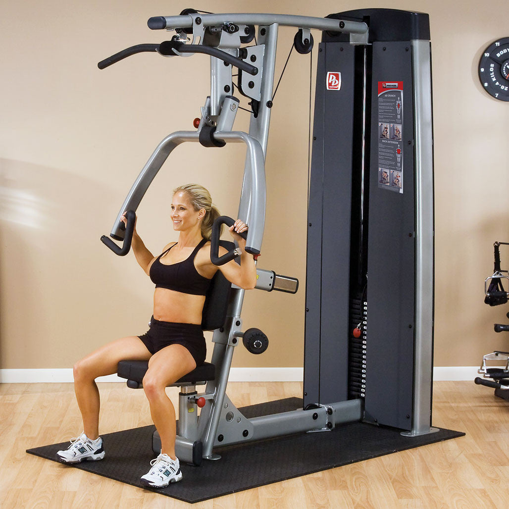 Body-Solid Dual Press Lat Station DPLS-SF - person performing chest press exercise