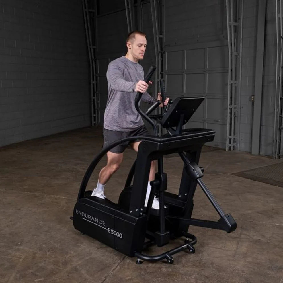 Body-Solid Endurance E5000 Center Drive Elliptical - person using machine in motion