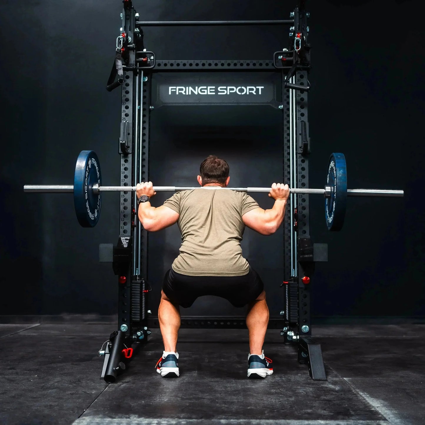 Fringe Sport The Dane 2.0 Half Rack - three-quarter view highlighting honeycomb pegboard attachment